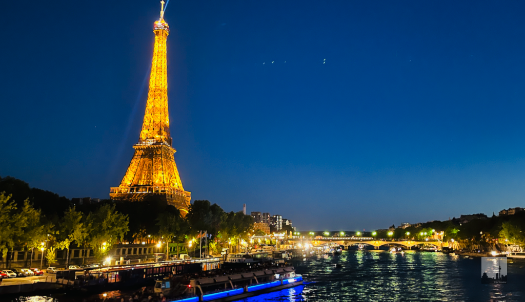 Romantic view over the Seine, the illuminated Eiffel Tower and Pont d’Iéna.