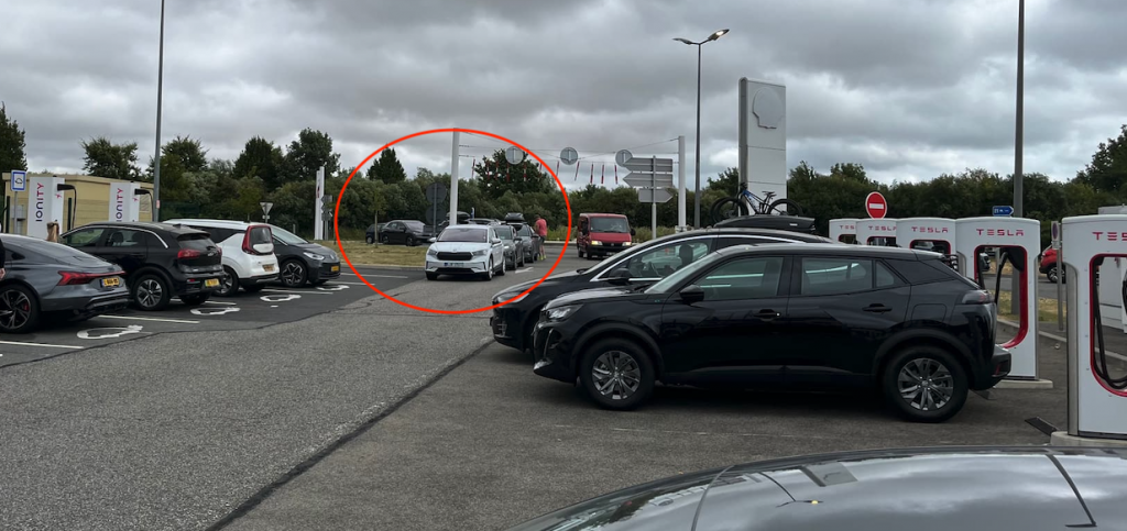 Cars waiting in line at a service station on a motorway
